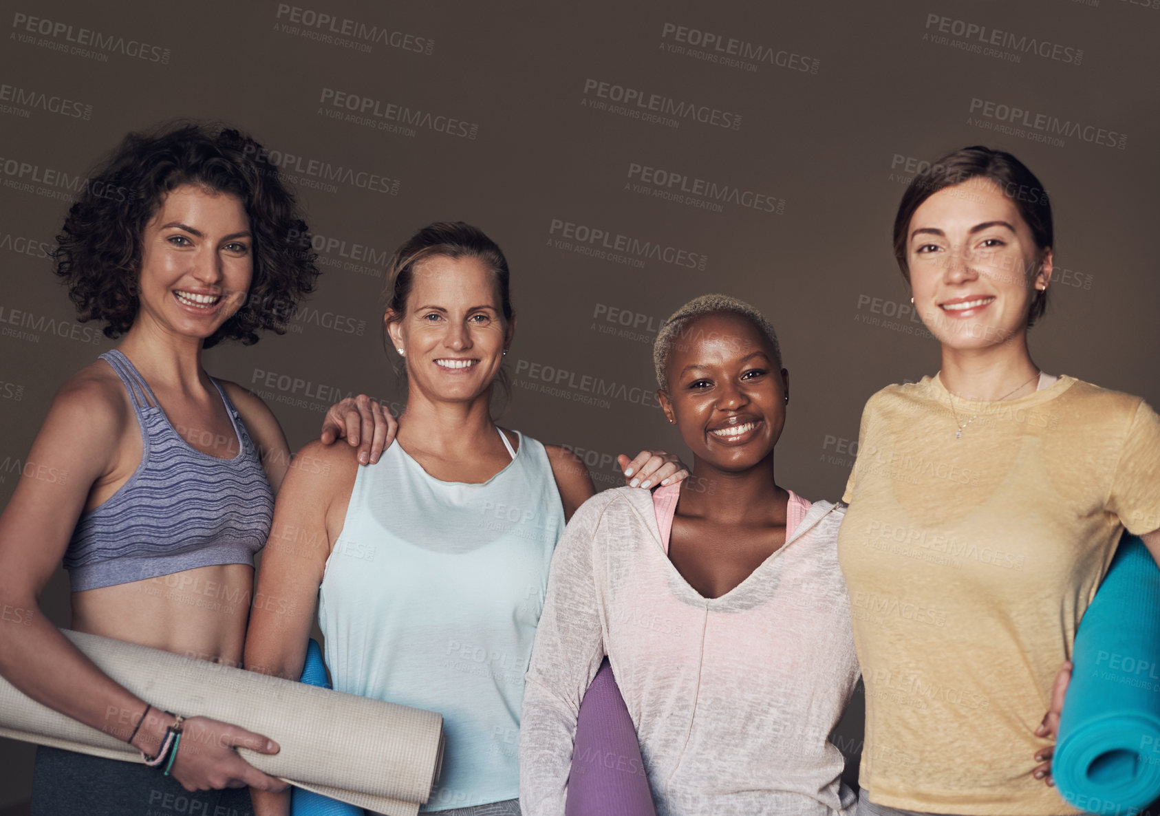 Buy stock photo Cropped portrait of a young group of woman sitting together and bonding during an indoor yoga session