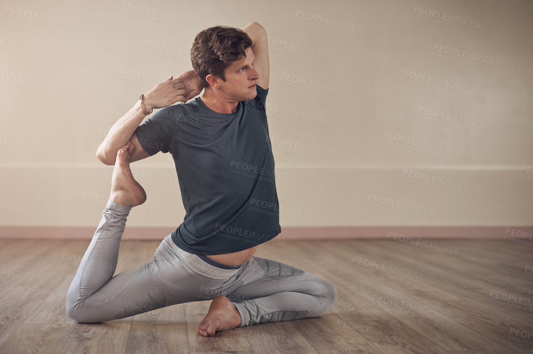 Buy stock photo Flexible, yoga or man in home for exercise, wellness or body posture with mermaids pose, routine or peace. Relax, zen or male person on floor for mindfulness, wellbeing or balance in pilates session