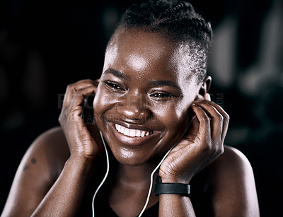 Buy stock photo Radio, workout and black woman in gym for fitness, exercise and cardio training with earphones for wellness audio. Podcast, bodybuilder and african lady for health or smile, happy or excited by music