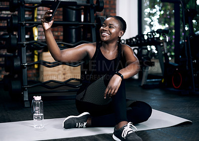 Buy stock photo Black woman, gym and selfie for social media, influencer and online for sports workout. Smile, profile picture and smartphone for internet app, happy and female person for cardio training in studio