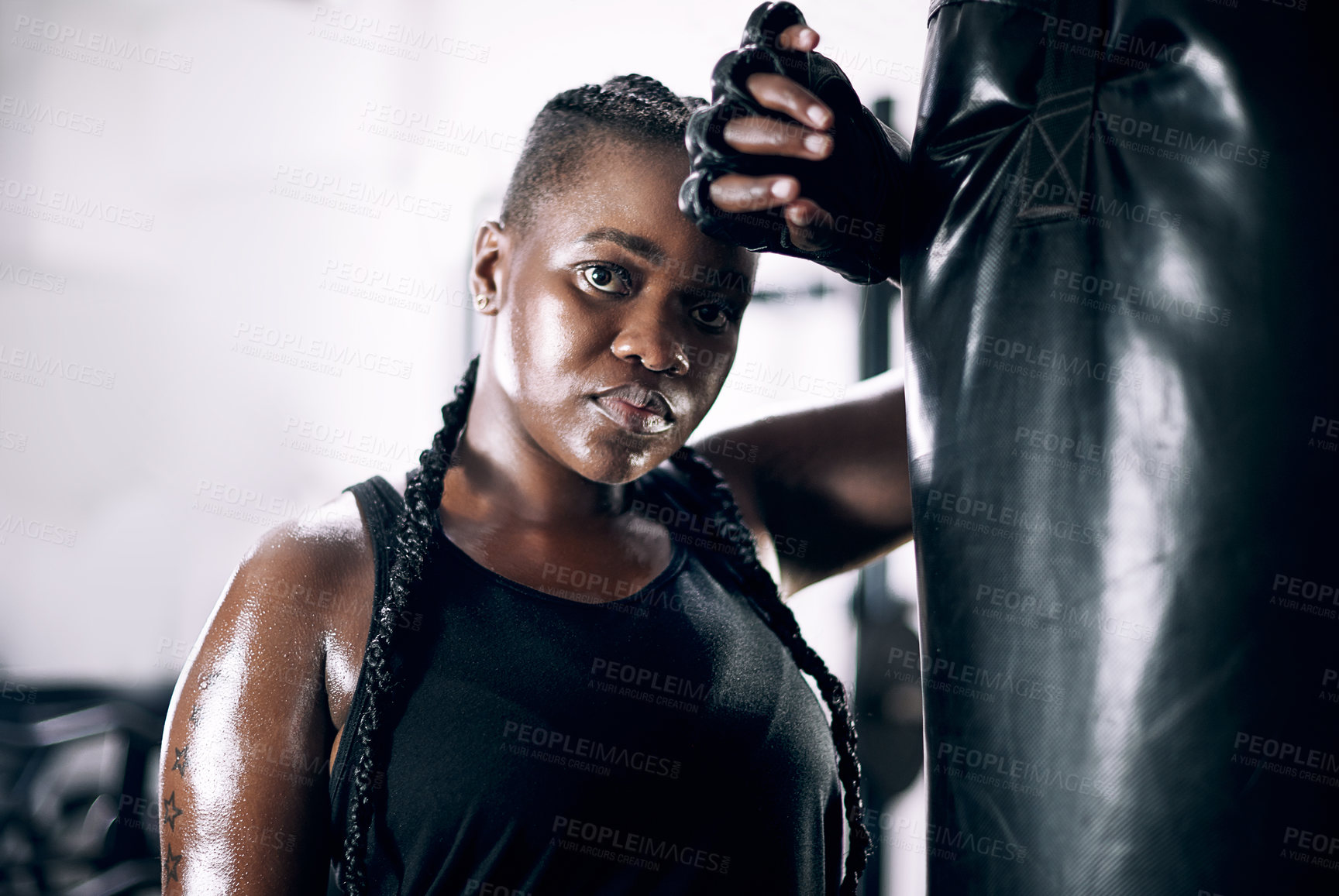 Buy stock photo Black woman, portrait and boxing bag for fitness, sweat and confidence for workout. Training, combat sports and cardio for body health and wellness, serious and gloves for African person in gym