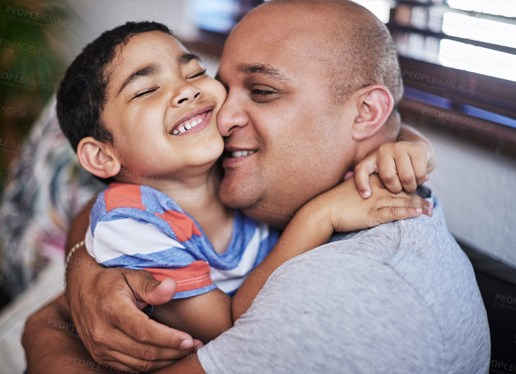 Buy stock photo Father, son and hug with affection, love for relationship in home as family in bonding. Man, boy and fun for activity in together in learning, childhood development and growth on weekend in support