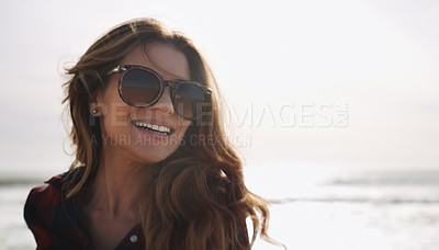 Buy stock photo Cropped shot of a beautiful woman enjoying herself at the beach