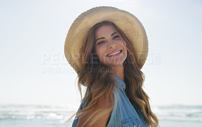 Buy stock photo Cropped portrait of an attractive young woman enjoying the beach on a summer's day