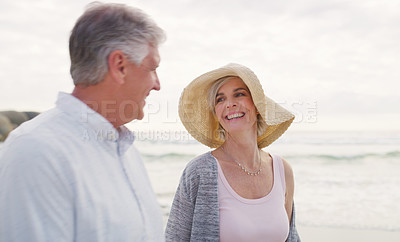 Buy stock photo Cropped shot of an affectionate senior couple enjoying the beach on a summer's day
