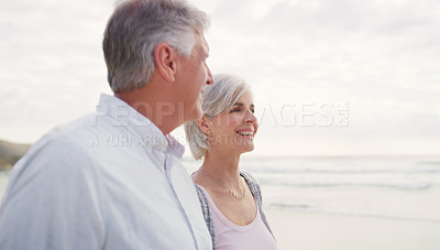 Buy stock photo Cropped shot of an affectionate senior couple enjoying the beach on a summer's day