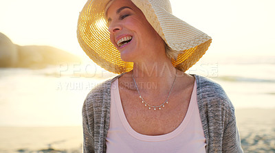 Buy stock photo Cropped shot of an attractive senior woman enjoying the beach at sunset