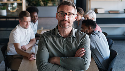 Buy stock photo Portrait of a confident mature businessman in in the office boardroom with his colleagues in the background