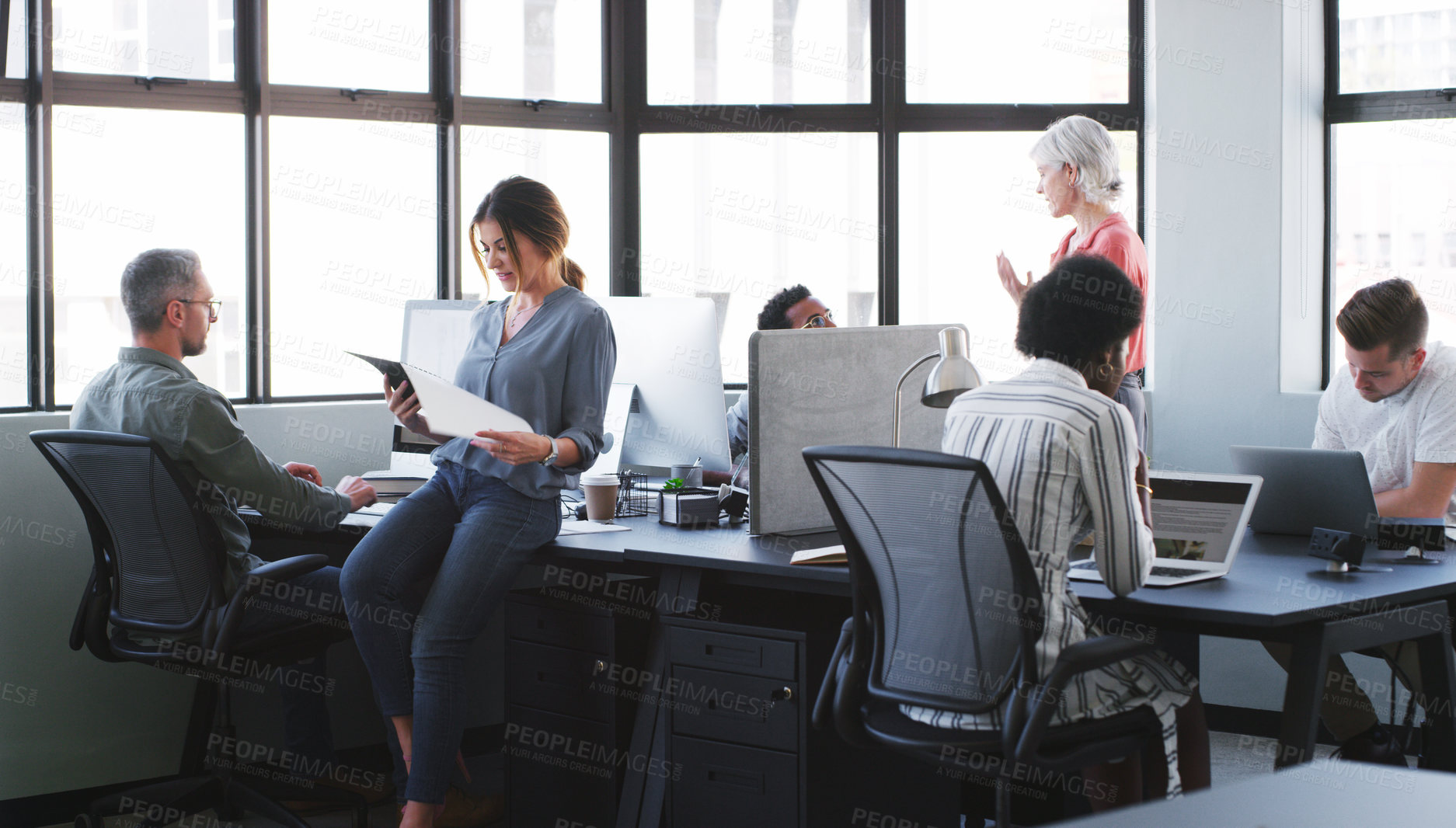 Buy stock photo Shot of a team of diverse businesspeople working together in a modern office