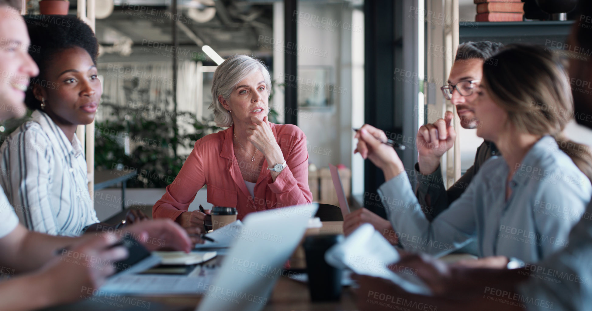 Buy stock photo Shot of a group of businesspeople having a meeting in a modern office