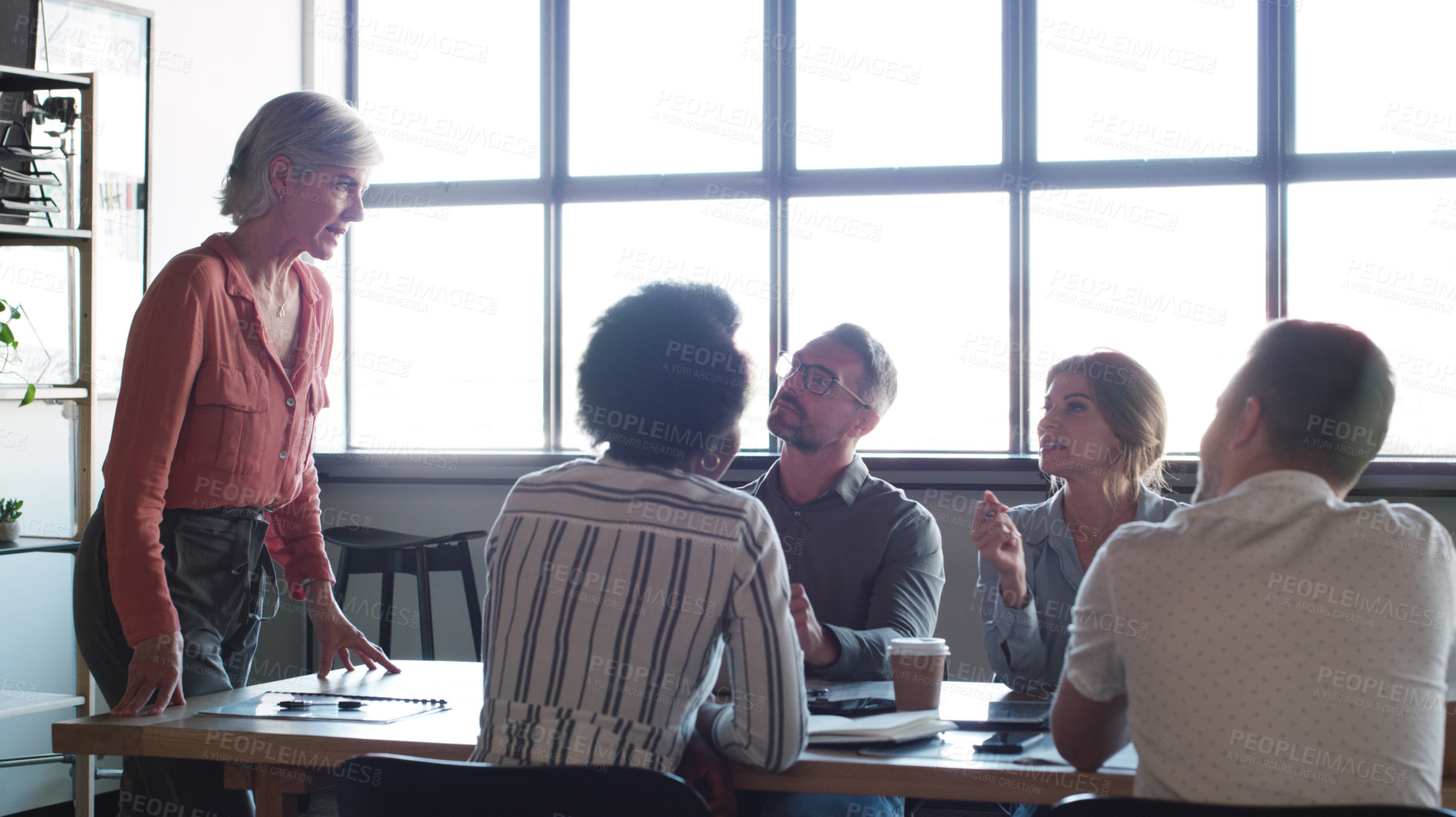 Buy stock photo Shot of a group of businesspeople having a meeting in a modern office