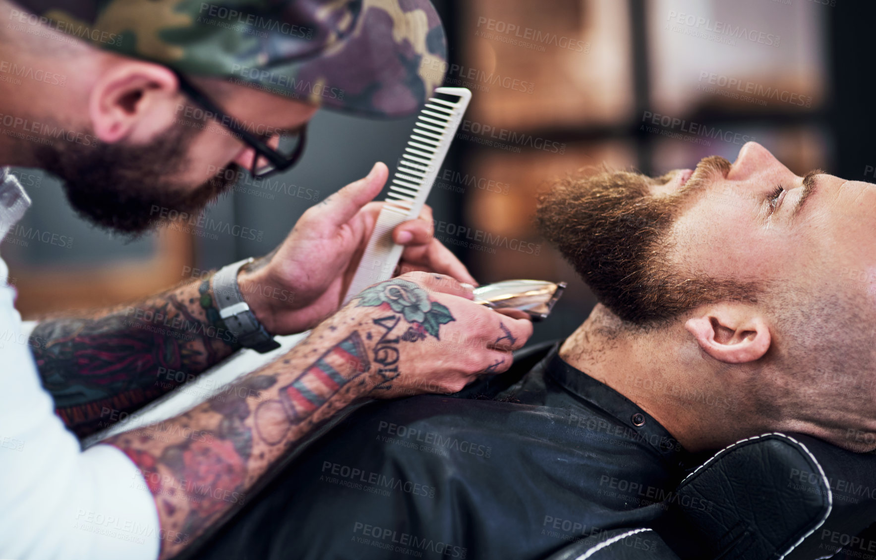 Buy stock photo Beard, client and man in barbershop with shave, cut and tools for trendy facial hair care at small business. Style, barber and customer in chair for grooming service, haircut skills and clean trim