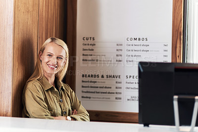 Buy stock photo Portrait of an attractive young hairdresser working at the reception area of her salon