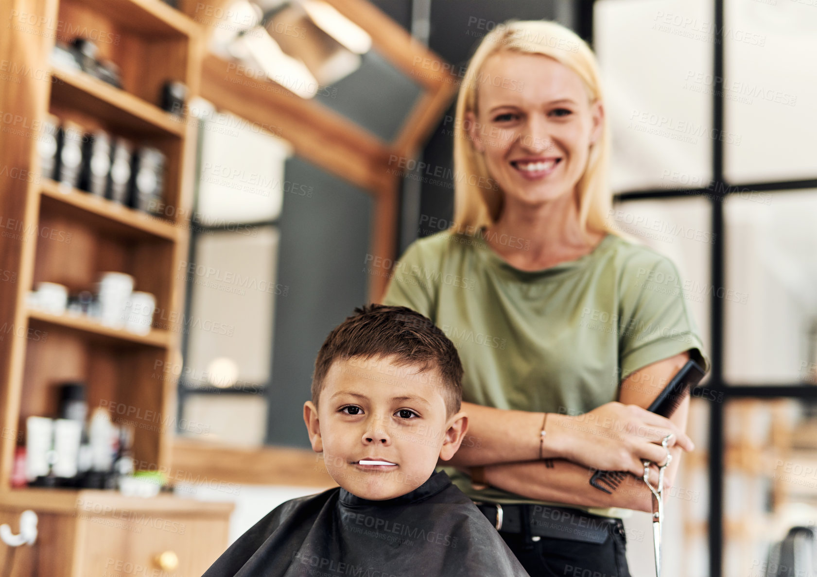 Buy stock photo Portrait of an adorable little boy getting a haircut at a salon