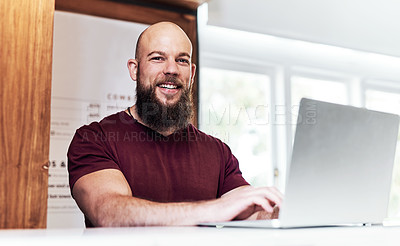 Buy stock photo Portrait of a handsome young barber working at the reception area of his barbershop