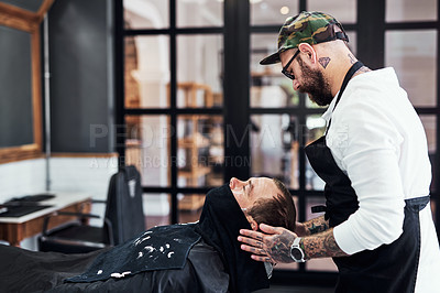 Buy stock photo Cropped shot of a handsome mature man getting his beard trimmed and lined up at a barbershop