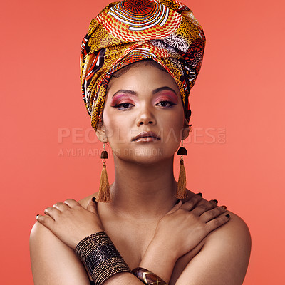 Buy stock photo African fashion, beauty and portrait of woman on orange background with cosmetics, makeup and accessories. Glamour, model and face of female person with exotic jewelry, traditional style and scarf