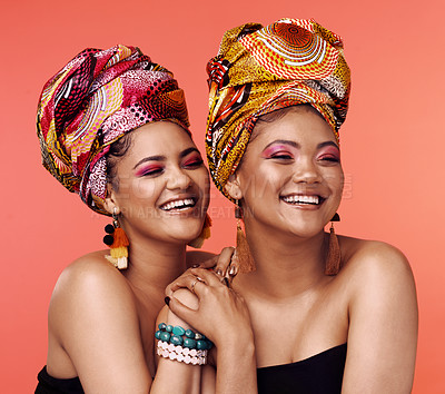 Buy stock photo African fashion, friends and women laugh on orange background with cosmetics, makeup and accessories. Glamour, luxury and face of female people with exotic jewelry, traditional style and head scarf
