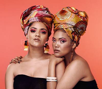 Buy stock photo African fashion, beauty and portrait of women on orange background with cosmetics, makeup and accessories. Glamour, friends and female people with exotic jewelry, traditional style and head scarf