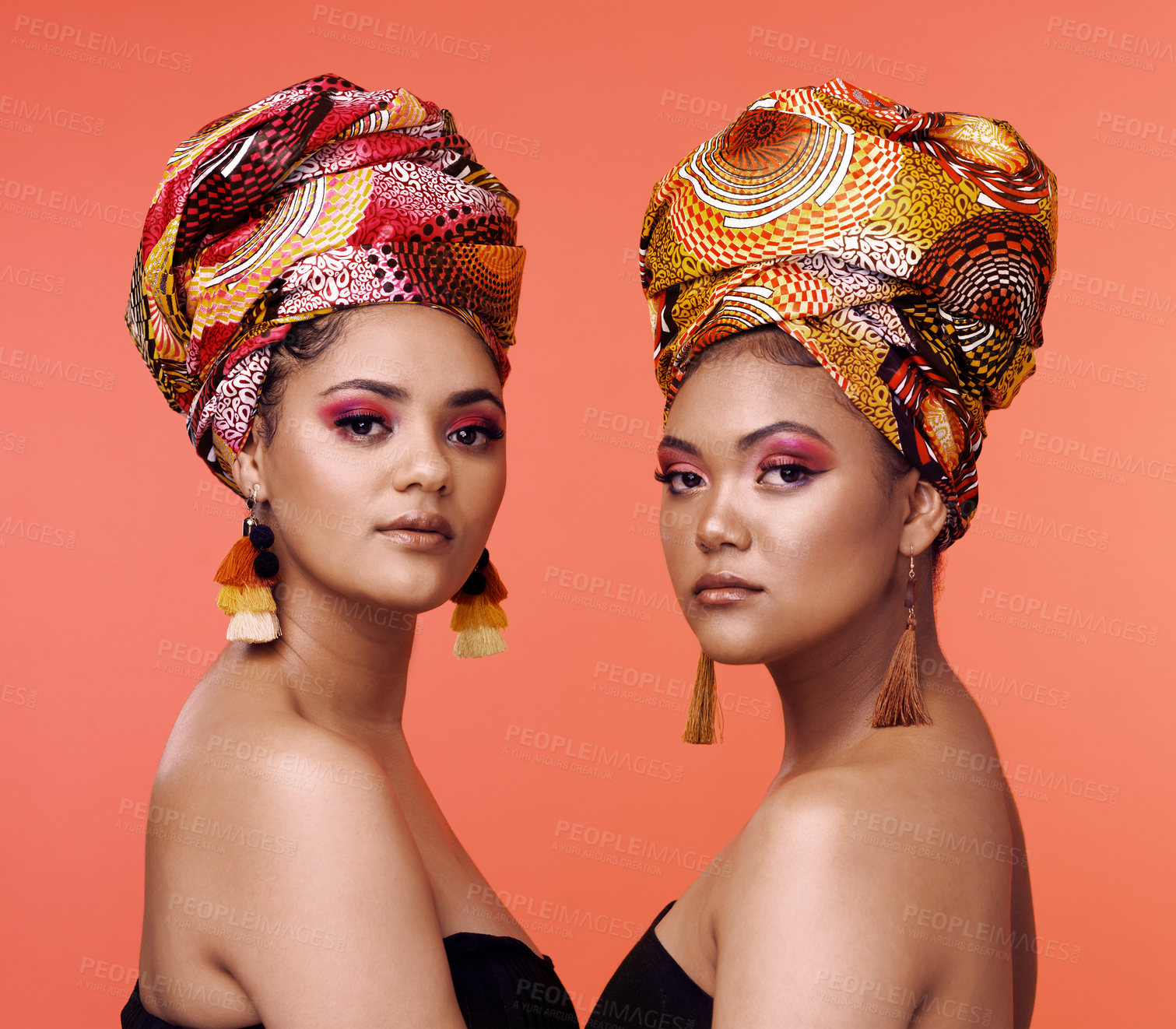 Buy stock photo African fashion, beauty and portrait of women on orange background with cosmetics, makeup and accessories. Glamour, studio and face of female people with exotic jewelry, traditional style and luxury