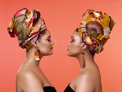 Buy stock photo African fashion, beauty and profile of women on orange background with cosmetics, makeup and accessories. Glamour, luxury and female people with exotic jewelry, traditional style and scarf in studio