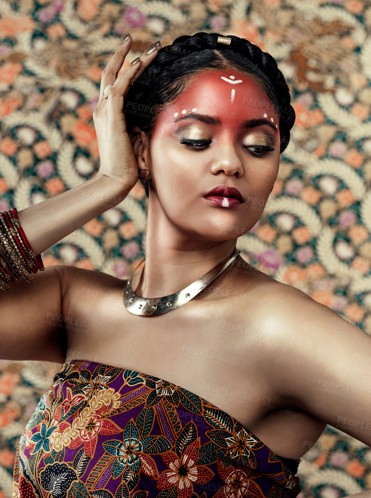 Buy stock photo Pride, culture and girl with beauty, traditional and makeup or paint, red and color for tribe and respect. Pattern, background and art for religion, indigenous and person with clothes or attire