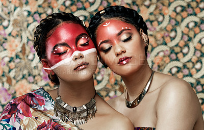 Buy stock photo Tribal, makeup and culture of Native American Indian women with pride in beauty, face paint and jewelry. Traditional, models and indigenous costume of warrior spirit in fashion with pattern on skin