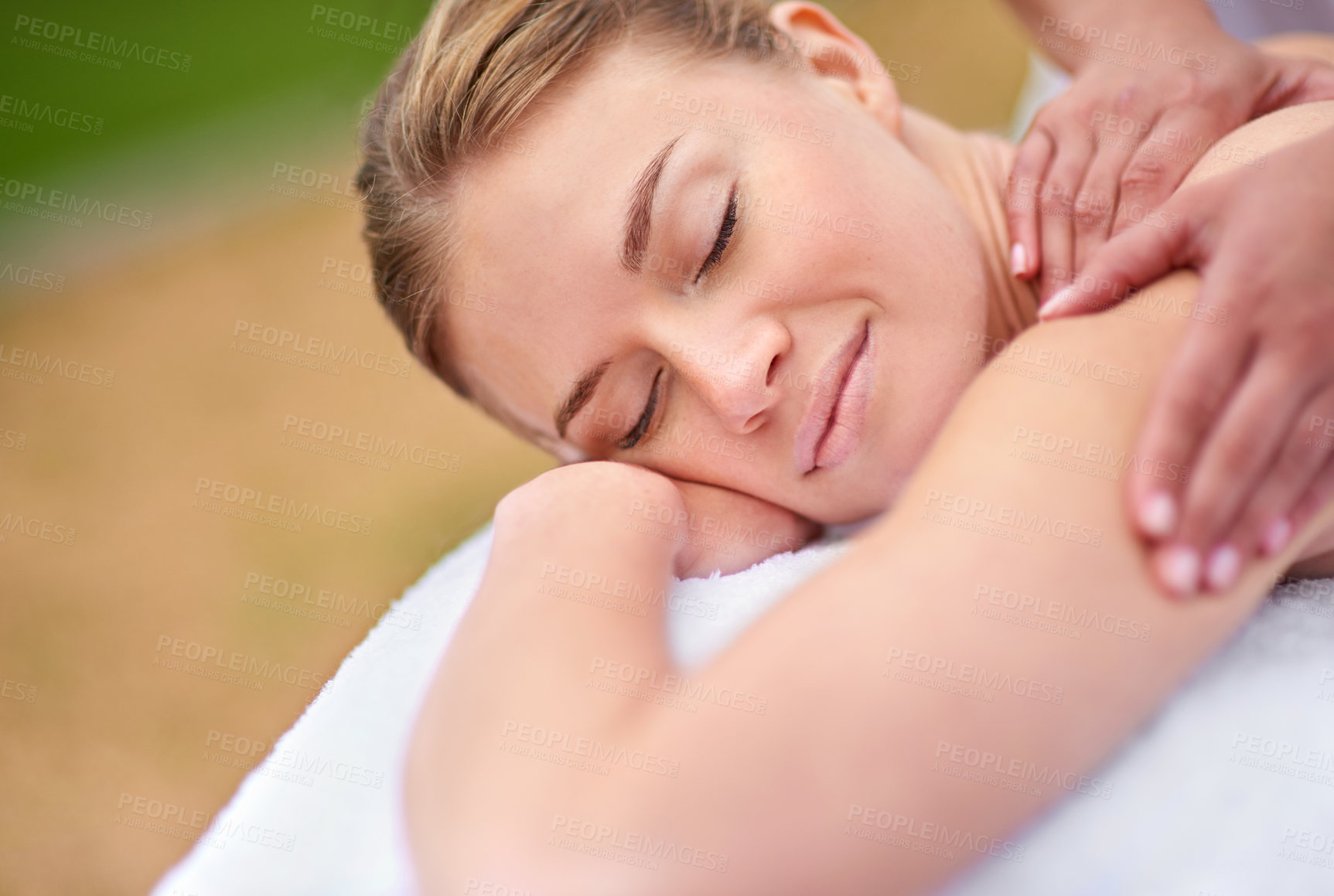 Buy stock photo Massage, woman and spa for therapy, wellness and relaxation in muscles, back and neck for self care. Female person, physical health and detox for body with smile, calm and happiness on holiday