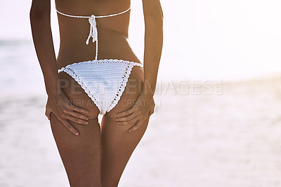 Buy stock photo Cropped shot of an unrecognizable woman in a bikini at the beach