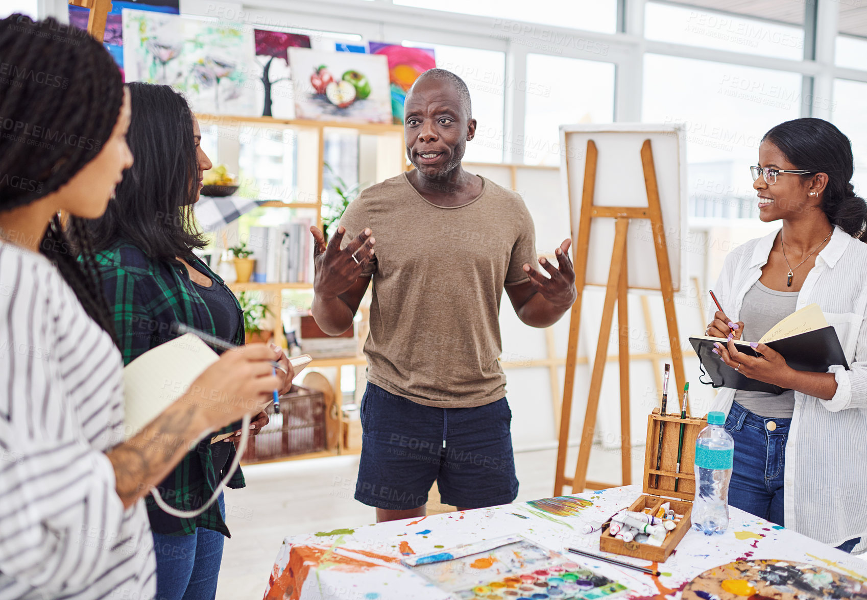Buy stock photo Cropped shot of a ground of people having a discussion in a art class