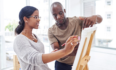 Buy stock photo Cropped shot of a woman talking to her teacher in a art class