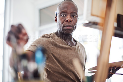 Buy stock photo Black man, artist and paintbrush for easel painting or small business project, career or equipment. Male person, creativity and color palette for craft hobby or art therapy class, relax or picture