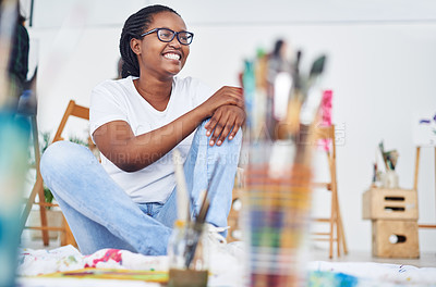 Buy stock photo College, woman and thinking of painting in class with inspiration for project on canvas. African, girl and painter on floor learning with talent for art, color and skill for watercolor in school