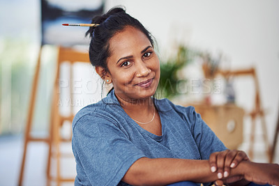 Buy stock photo Cropped shot of a beautiful young woman sitting in a art studio