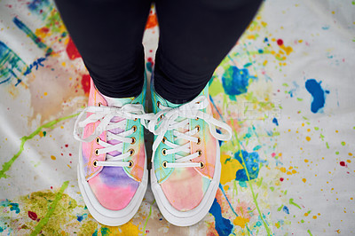 Buy stock photo Cropped shot of an unrecognizable woman standing with colorful shoes on a painted cloth