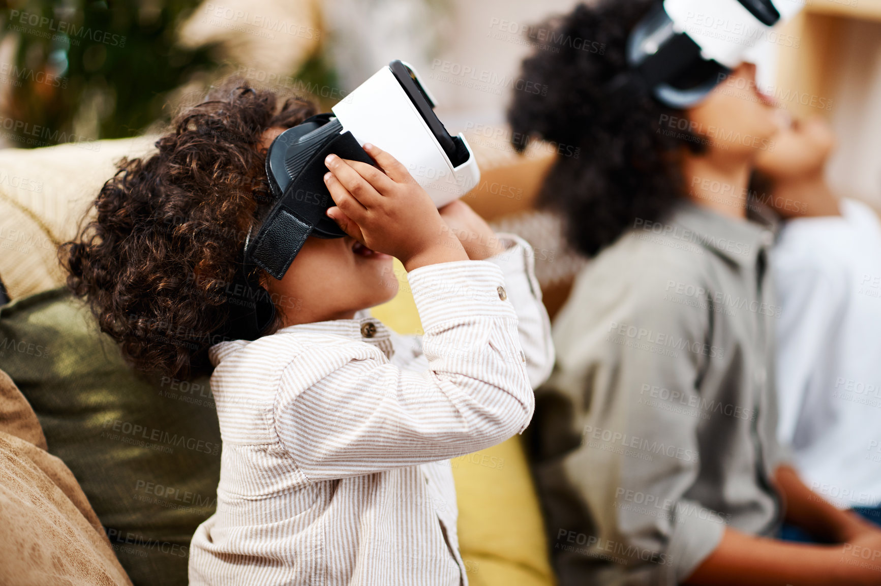 Buy stock photo Cropped shot of three little boys watching movies together through virtual reality headsets at home