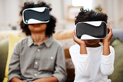 Buy stock photo Cropped shot of two little boys watching movies together through virtual reality headsets at home