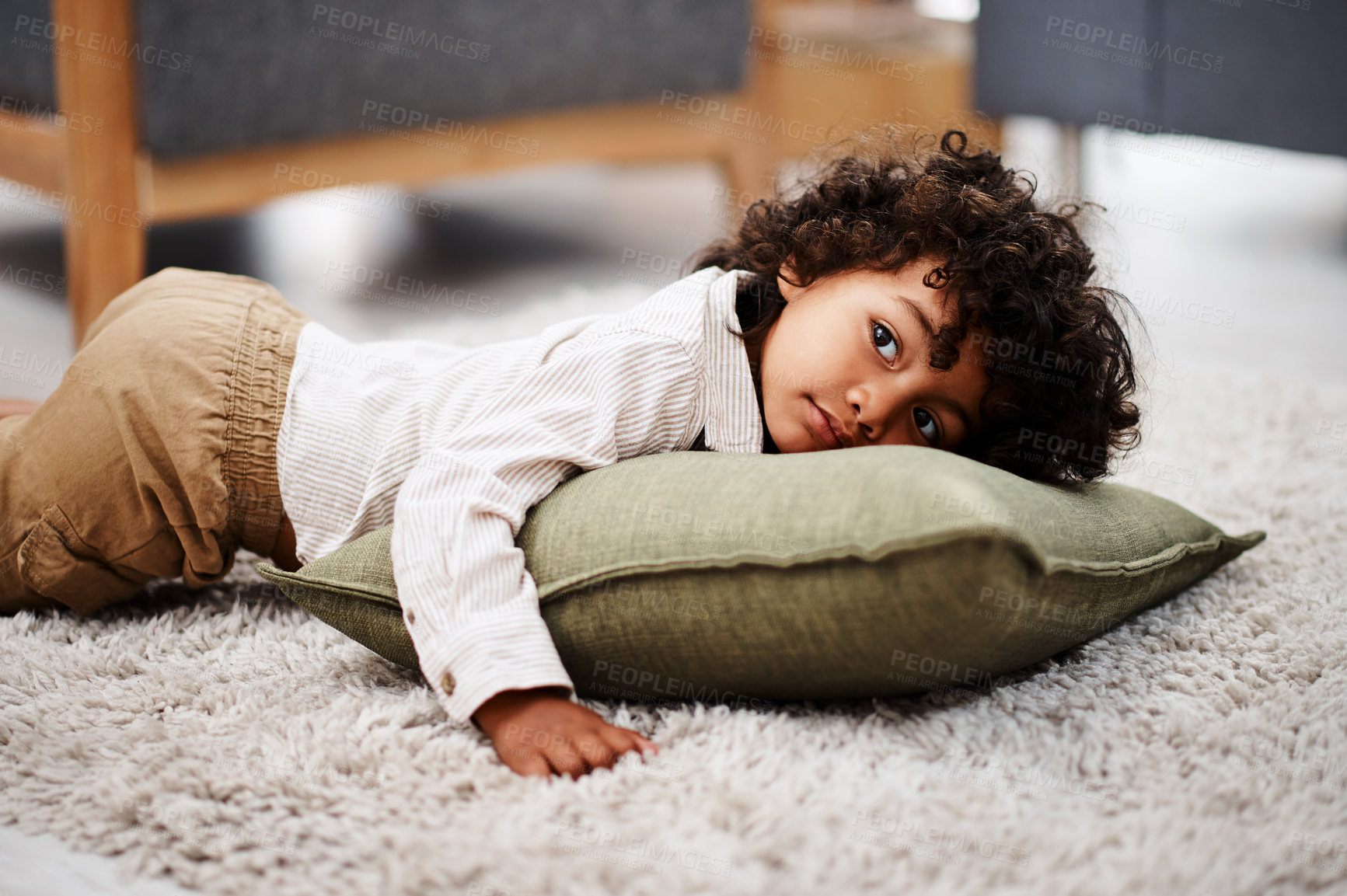 Buy stock photo Relax, watching tv and child on floor in home living room on pillow for movie, film and show. House, kid and streaming television for cartoon, media and cute boy lying in lounge for entertainment