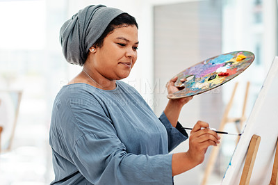 Buy stock photo Woman student, muslim and painting in art class with canvas for university project, inspiration or education. Workshop. easel and person with palette for relax, watercolor or creativity in studio