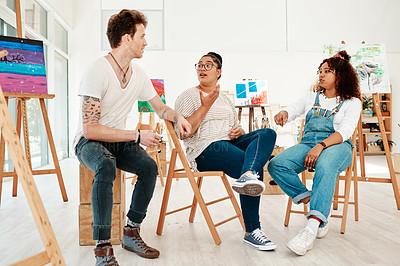 Buy stock photo Cropped shot of a diverse group of friends sitting together and talking during an art class in the studio