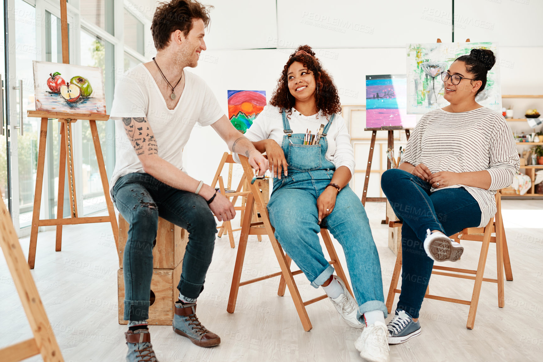 Buy stock photo Painter, people and meeting in studio of ideas, creativity and brainstorming in workshop for learning or teamwork. Young artist, group and mentor or class teacher planning and talking in art gallery