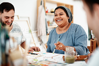 Buy stock photo Cropped shot of a diverse group of artists sitting together and painting during an art class in a studio