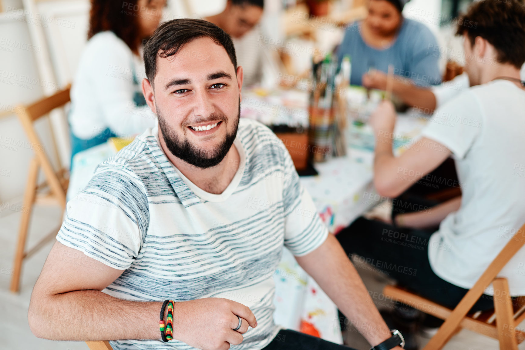 Buy stock photo Happy, man and portrait in workshop for creativity, talent and pride for group project in art class. Male person, smile and together with friends for paint therapy, watercolor or acrylic and drawing