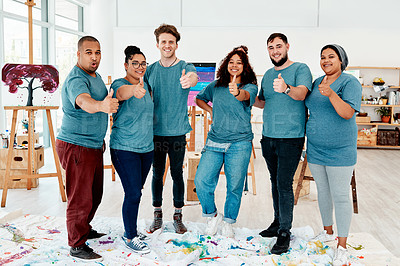 Buy stock photo Full length portrait of a diverse group of friends standing together and showing a thumbs up after an art class