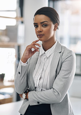 Buy stock photo Portrait of an attractive and confident young businesswoman posing inside her office