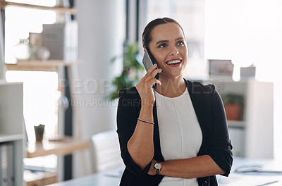 Buy stock photo Cropped shot of an attractive young businesswoman answering a phone call inside her office