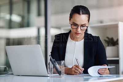 Buy stock photo Cropped shot of an attractive young businesswoman working inside her office