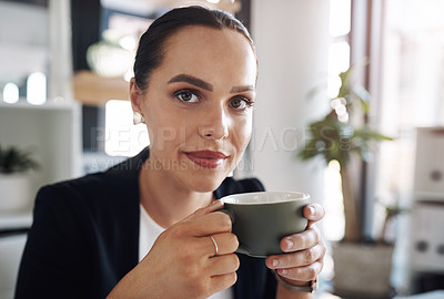 Buy stock photo Portrait of an attractive young businesswoman drinking coffee inside her office