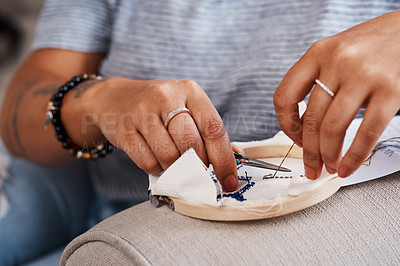 Buy stock photo Cropped shot of an unrecognizable woman doing embroidery at home