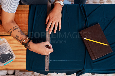 Buy stock photo Cropped shot of an unrecognizable woman making a garment at home